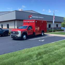 Photo of Epworth Fire Department New Delivery outside of foster coach.