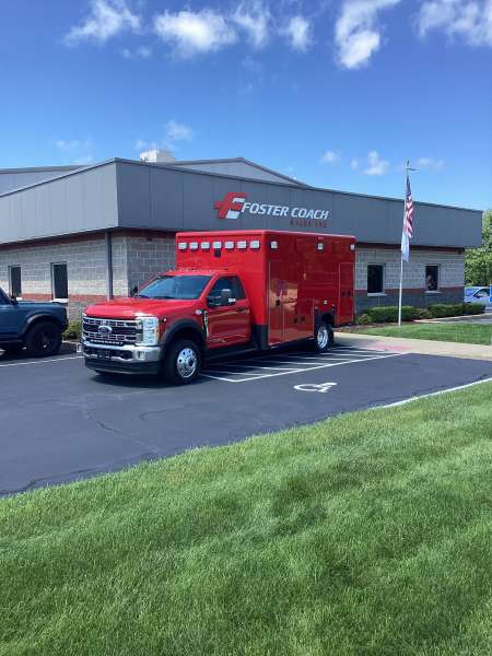 Photo of Epworth Fire Department New Delivery outside of foster coach.