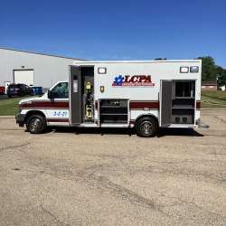 Photo of Logan County Paramedics Ambulance Side View Opened