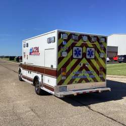 Photo of Logan County Paramedics Ambulance Side Back View