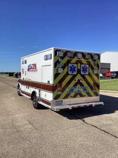 Photo of Logan County Paramedics Ambulance Side Back View