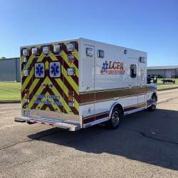 Photo of Logan County Paramedics Ambulance Side Back View 2