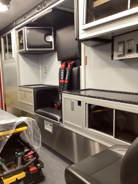 Photo of New Delivery Lake Geneva Fire Department ambulance interior shot showcasing hardware and equipment.