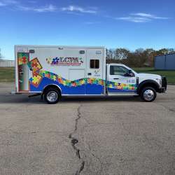 Photo of Logan County Paramedics new delivery showcasing the exterior of the vehicle and it's features.