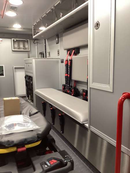 Photo of New Delivery Mundelein Fire Department interior view of the ambulance showcasing various hardware, cabinetry, and more.