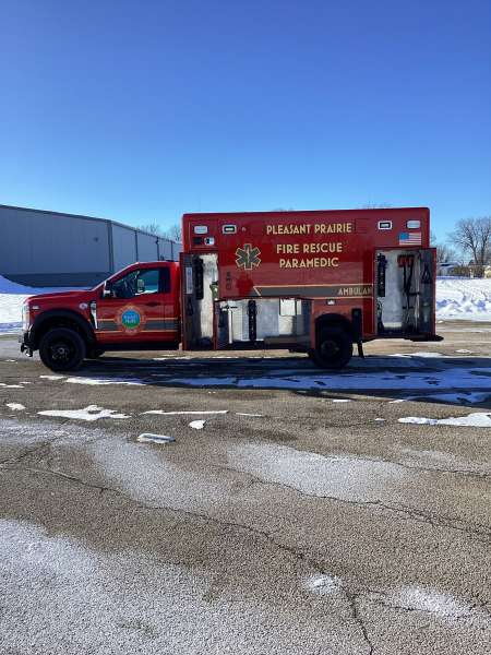 Photo of New Delivery Pleasant Prairie Fire Rescue exterior shot showcasing the ambulance with snow surrounding.