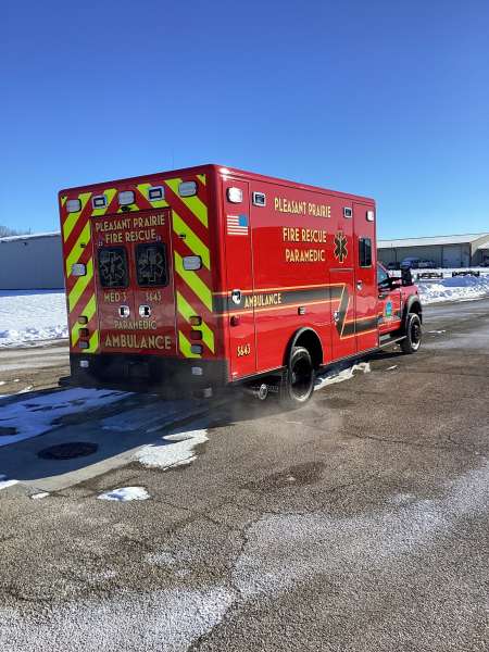 Photo of New Delivery Pleasant Prairie Fire Rescue exterior shot showcasing the ambulance with snow surrounding.