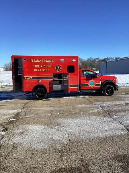 Photo of New Delivery Pleasant Prairie Fire Rescue exterior shot showcasing the ambulance with snow surrounding.
