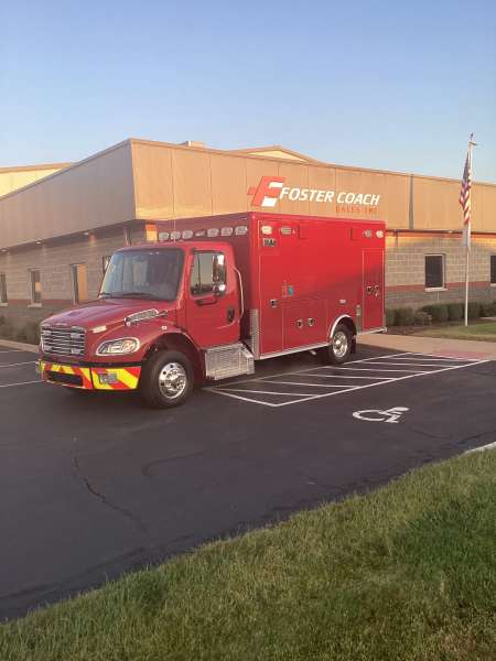 Photo of Spring Grove fire Department New Delivery outside the Foster Coach building.