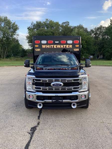 Photo of New Delivery Whitewater Fire Department Outside showcasing the new ambulance.