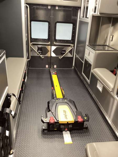 Photo of New Delivery Win Bur Sew Fire Protection Dist. ambulance interior showcasing various equipment and hardware.