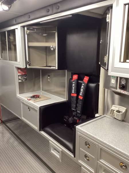 Photo of Foster Coach new delivery for East Joliet Fire showcasing the interior and cabin of the new vehicle.
