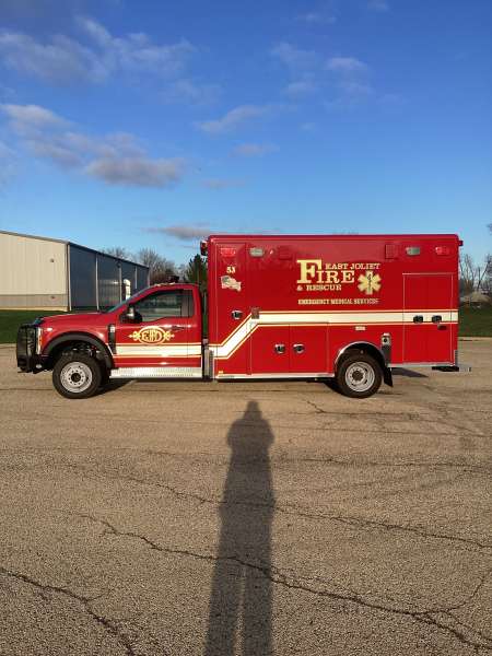 Photo of Foster Coach new delivery for East Joliet Fire showcasing the exterior of the new vehicle.