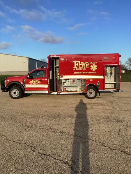 Photo of Foster Coach new delivery for East Joliet Fire showcasing the exterior of the new vehicle.