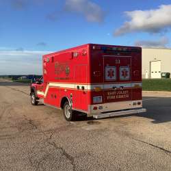 Photo of Foster Coach new delivery for East Joliet Fire showcasing the exterior of the new vehicle.