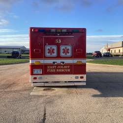 Photo of Foster Coach new delivery for East Joliet Fire showcasing the exterior of the new vehicle.