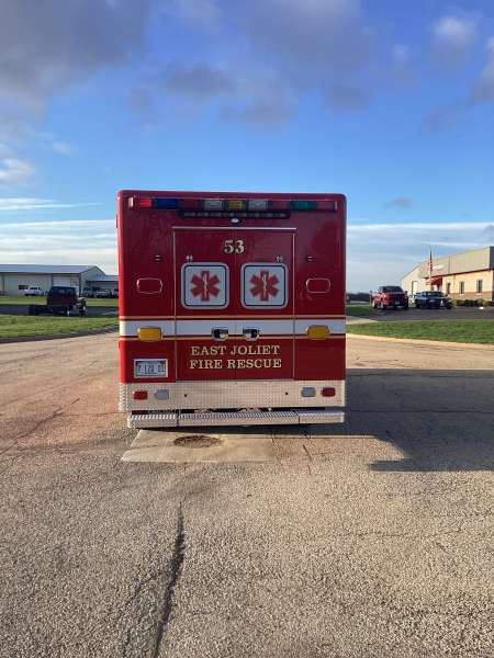 Photo of Foster Coach new delivery for East Joliet Fire showcasing the exterior of the new vehicle.