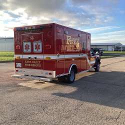 Photo of Foster Coach new delivery for East Joliet Fire showcasing the exterior of the new vehicle.