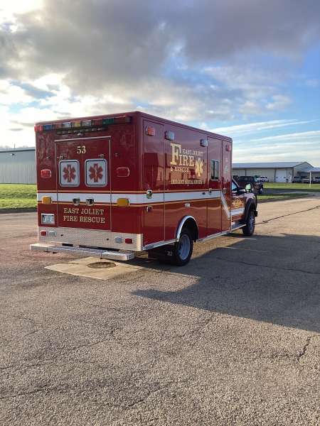 Photo of Foster Coach new delivery for East Joliet Fire showcasing the exterior of the new vehicle.
