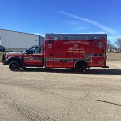 Photo of City of Pewaukee Paramedic Unit ambulance parked outdoors.