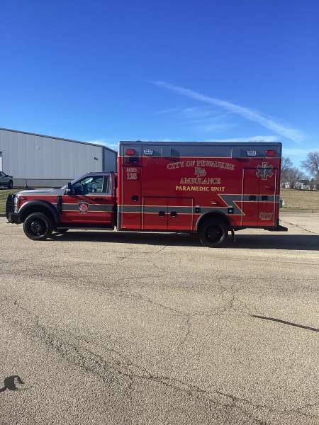 Photo of City of Pewaukee Paramedic Unit ambulance parked outdoors.