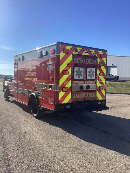 Photo of City of Pewaukee Paramedic Unit ambulance parked outdoors.
