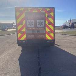Photo of City of Pewaukee Paramedic Unit ambulance parked outdoors.