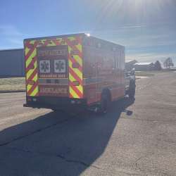 Photo of City of Pewaukee Paramedic Unit ambulance parked outdoors.