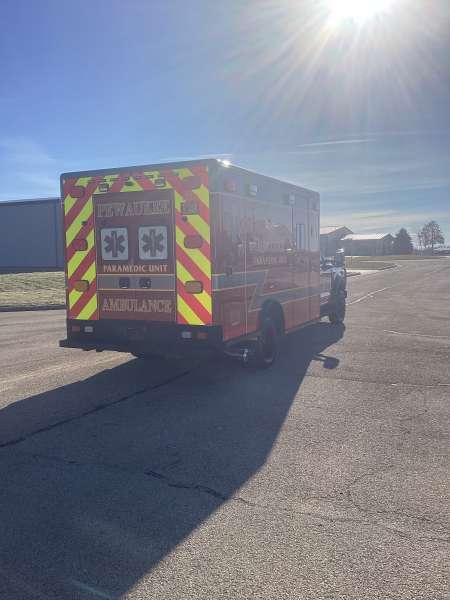 Photo of City of Pewaukee Paramedic Unit ambulance parked outdoors.