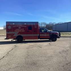 Photo of City of Pewaukee Paramedic Unit ambulance parked outdoors.