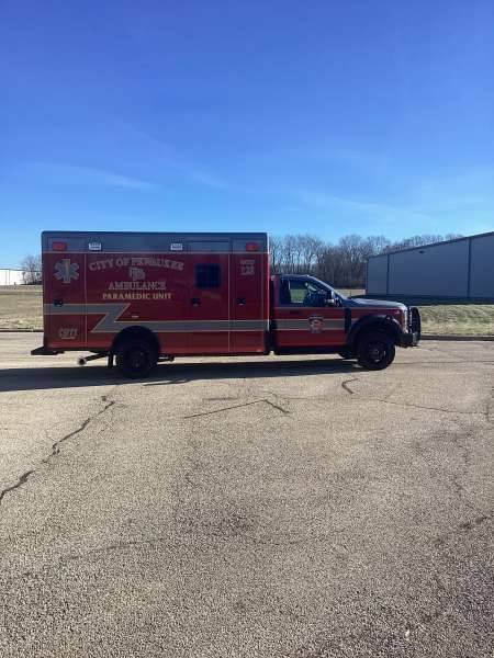 Photo of City of Pewaukee Paramedic Unit ambulance parked outdoors.