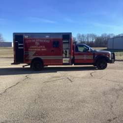 Photo of City of Pewaukee Paramedic Unit ambulance parked outdoors.