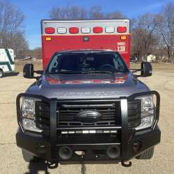 Photo of City of Pewaukee Paramedic Unit ambulance parked outdoors.