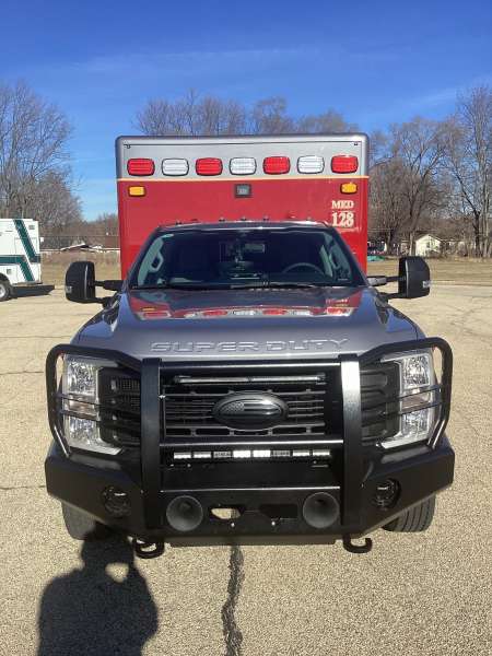 Photo of City of Pewaukee Paramedic Unit ambulance parked outdoors.