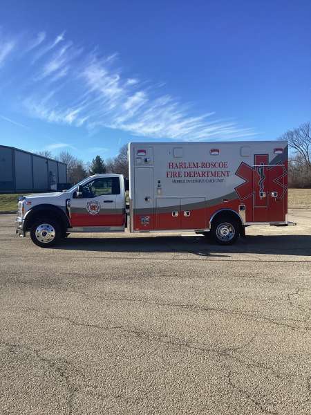 Photo of Roscoe Fire Department ambulance vehicle being showcased outside.