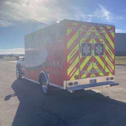 Photo of Roscoe Fire Department ambulance vehicle being showcased outside.