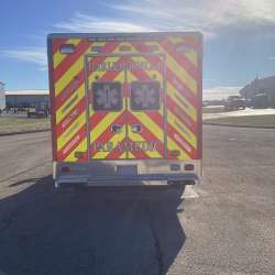 Photo of Roscoe Fire Department ambulance vehicle being showcased outside.