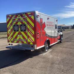 Photo of Roscoe Fire Department ambulance vehicle being showcased outside.