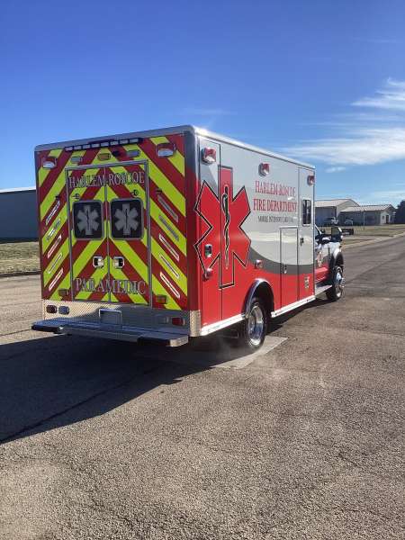 Photo of Roscoe Fire Department ambulance vehicle being showcased outside.