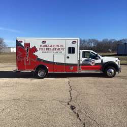 Photo of Roscoe Fire Department ambulance vehicle being showcased outside.