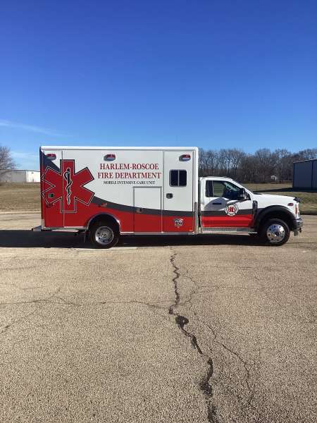 Photo of Roscoe Fire Department ambulance vehicle being showcased outside.