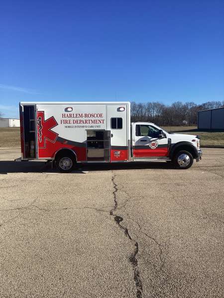 Photo of Roscoe Fire Department ambulance vehicle being showcased outside.
