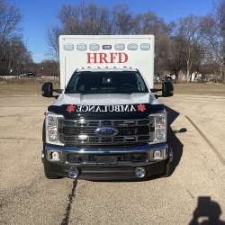 Photo of Roscoe Fire Department ambulance vehicle being showcased outside.