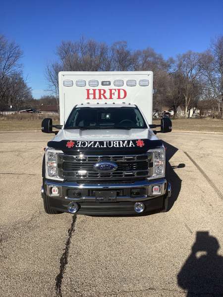 Photo of Roscoe Fire Department ambulance vehicle being showcased outside.