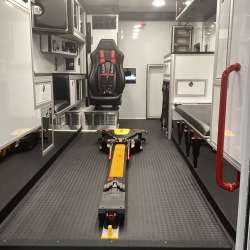 Photo of Roscoe Fire Department ambulance vehicle showing the interior with available equipment and hardware.