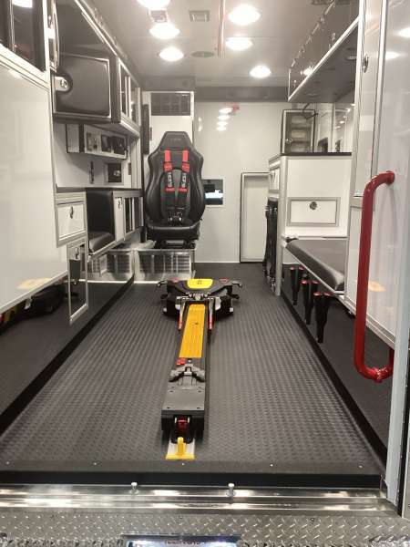 Photo of Roscoe Fire Department ambulance vehicle showing the interior with available equipment and hardware.