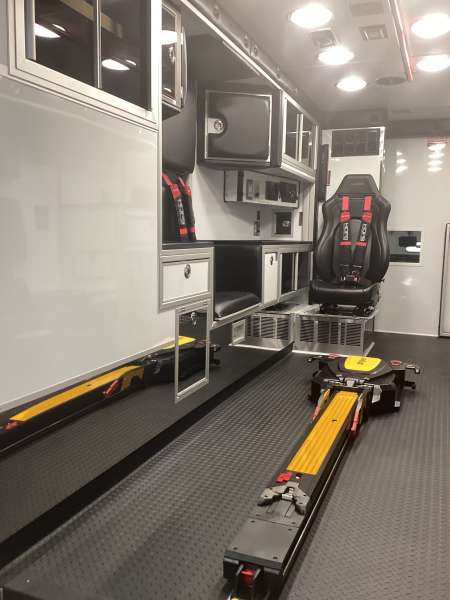 Photo of Roscoe Fire Department ambulance vehicle showing the interior with available equipment and hardware.