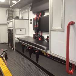 Photo of Roscoe Fire Department ambulance vehicle showing the interior with available equipment and hardware.