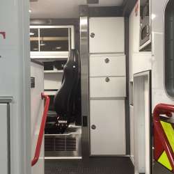 Photo of Roscoe Fire Department ambulance vehicle showing the interior with available equipment and hardware.
