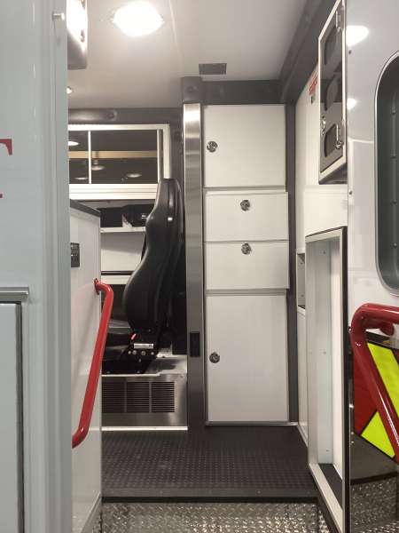 Photo of Roscoe Fire Department ambulance vehicle showing the interior with available equipment and hardware.